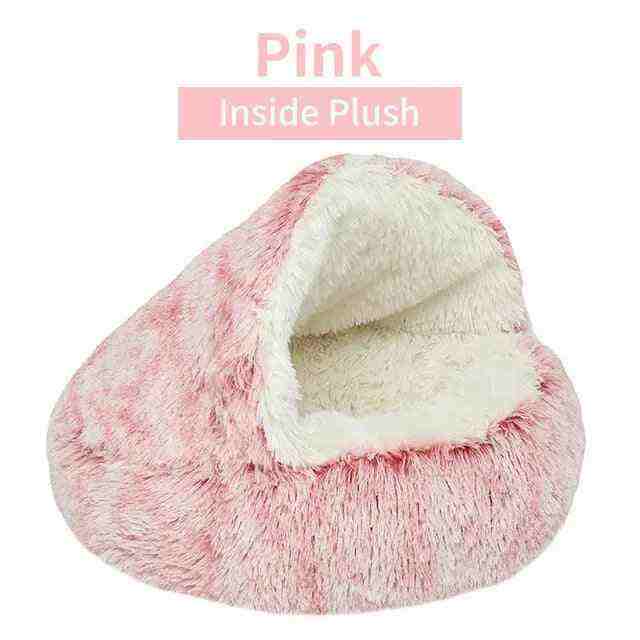 Soft plush pet bed in pink with ultra-plush fabric and raised edges for pet comfort and security