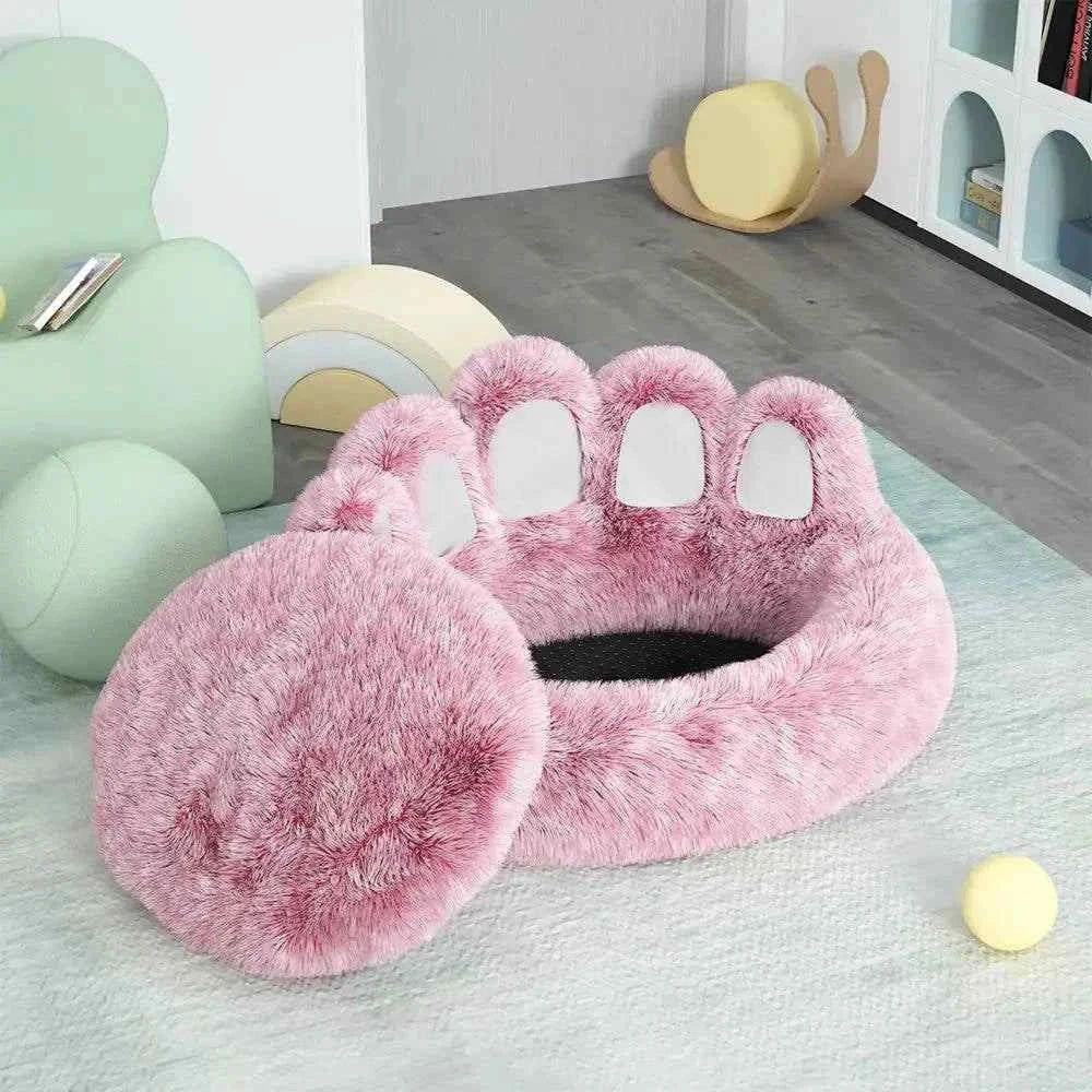 Long plush cat bed in pink faux fur with paw design, soft and cozy for cats to curl up and sleep comfortably