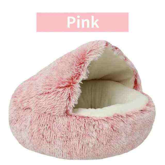 Soft plush pet bed in pink with ultra-plush fabric, raised edges, and cozy burrow design for pets
