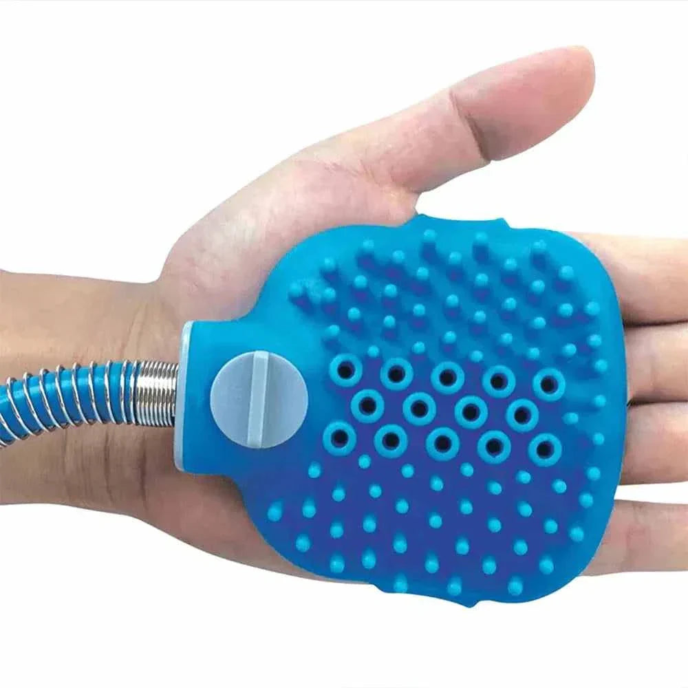 Blue ergonomic pet shower sponge with soft silicone bristles held in hand for gentle and effective pet bathing