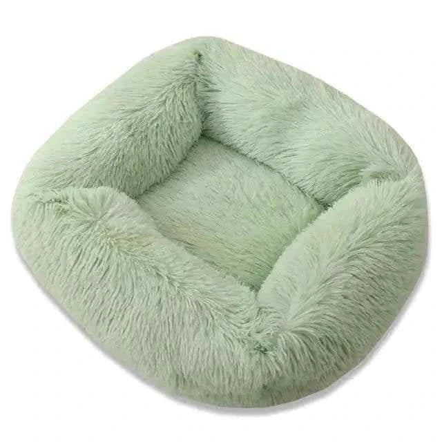 Cat sleeping on Plush Pet Bed with washable cover