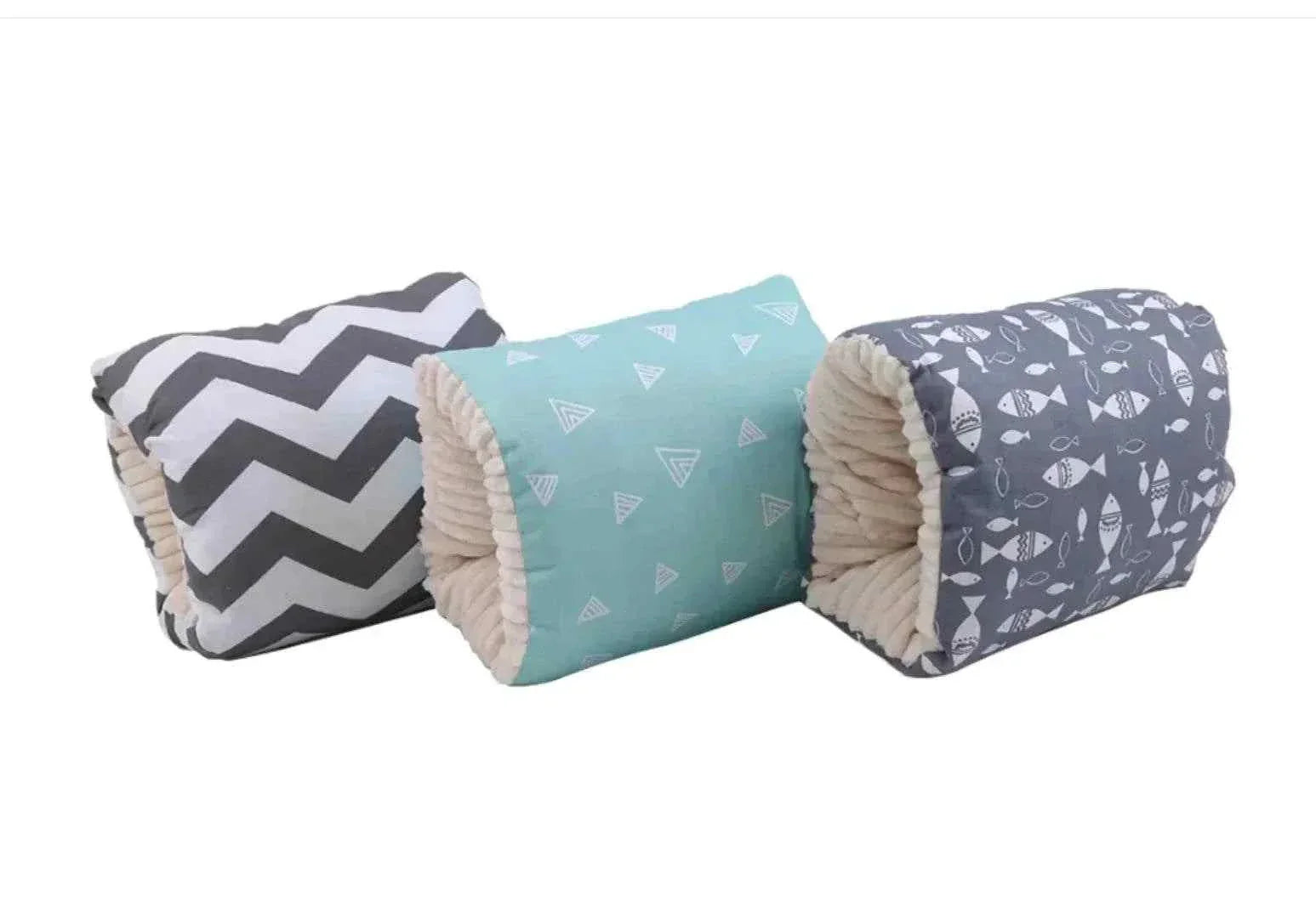 soft cozy nest baby cradles with patterned covers in gray chevron, turquoise triangles, and gray fish designs
