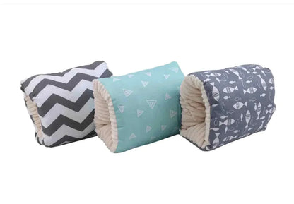 soft cozy nest baby cradles with patterned covers in gray chevron, turquoise triangles, and gray fish designs