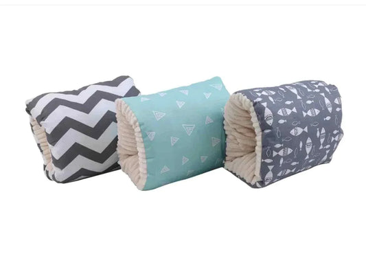 soft cozy nest baby cradles with patterned covers in gray chevron, turquoise triangles, and gray fish designs